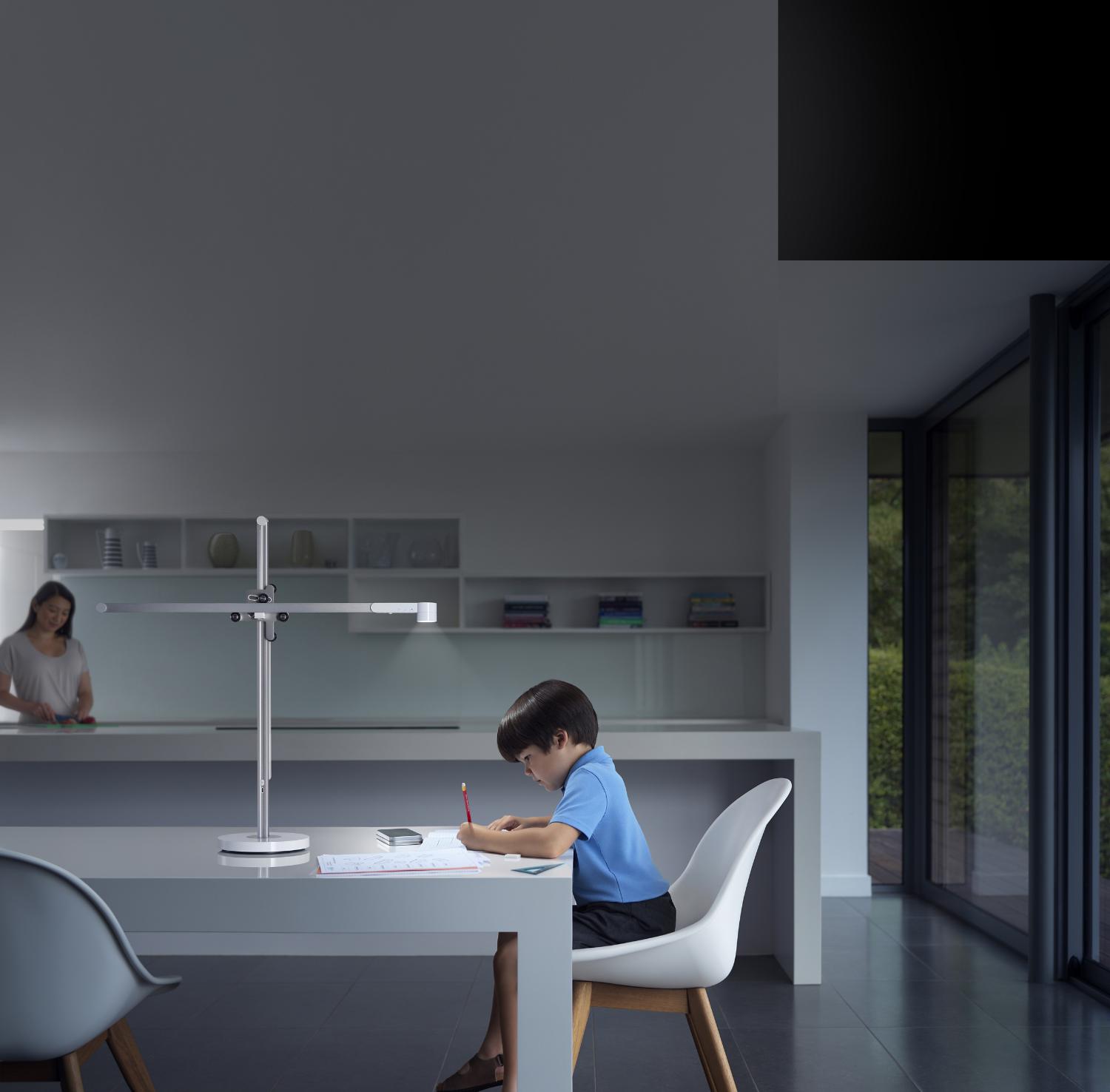 Studying at desk under powerful Dyson Lightcycle task light